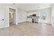 Modern kitchenette features stainless appliances, white cabinetry and is open to an adjacent room at 7304 Donnybrook Ln, Sarasota, FL 34240