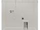 Bright laundry room features hookups and shelving for optimal organization at 7304 Donnybrook Ln, Sarasota, FL 34240