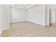 Bright living area features plank flooring, recessed lights and neutral paint at 7304 Donnybrook Ln, Sarasota, FL 34240