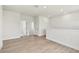 Bright living area with plank flooring, recessed lights and access to multiple rooms at 7304 Donnybrook Ln, Sarasota, FL 34240