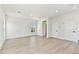 Bright living area features plank flooring, recessed lights and several access doors at 7304 Donnybrook Ln, Sarasota, FL 34240