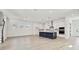Spacious, open-concept living area with a modern kitchen and lots of natural light at 7304 Donnybrook Ln, Sarasota, FL 34240