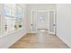 Bright office features glass doors, light wood floors, and a large window at 7304 Donnybrook Ln, Sarasota, FL 34240