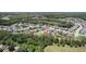 Beautiful aerial image of a neighborhood surrounded by lush greenery and ponds, offering privacy and tranquility at 8016 Rock Spring Ct, Land O Lakes, FL 34638