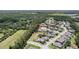 Overhead view displays the neighborhood's layout, highlighting lush landscaping and community ponds with surrounding woodlands at 8016 Rock Spring Ct, Land O Lakes, FL 34638