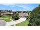 Beautiful single-Gathering home with a three-car garage, well-manicured lawn and a circular driveway in a quiet neighborhood at 8016 Rock Spring Ct, Land O Lakes, FL 34638