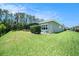 Fully fenced in backyard with well manicured lawn and shrubs at 8016 Rock Spring Ct, Land O Lakes, FL 34638