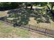 A fenced dog park features mature trees, benches and ample space for dogs at 8016 Rock Spring Ct, Land O Lakes, FL 34638