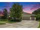 Beautiful single-Gathering home featuring lush landscaping, a spacious driveway, and a three-car garage at 8016 Rock Spring Ct, Land O Lakes, FL 34638