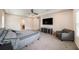 Bright main bedroom with carpet floors, TV, and ceiling fan at 8016 Rock Spring Ct, Land O Lakes, FL 34638
