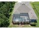 Aerial shot of a screened in pool with a seating area, and landscaping at 8016 Rock Spring Ct, Land O Lakes, FL 34638