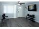 Open living room featuring stylish gray flooring, ceiling fan, and neutral wall color at 8996 Southern Comfort Dr, Largo, FL 33773