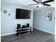 Bright, open living room featuring neutral paint colors and gray flooring at 8996 Southern Comfort Dr, Largo, FL 33773