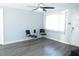 Bright living room with neutral wall color, gray flooring, and large window at 8996 Southern Comfort Dr, Largo, FL 33773