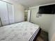 Main bedroom with a closet, flatscreen TV, and modern flooring at 8996 Southern Comfort Dr, Largo, FL 33773