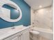 Beautifully renovated bathroom with marble tiling, updated cabinets, and a new tub at 9292 120Th Ln, Seminole, FL 33772