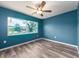 Bright bedroom with large window offers a serene view and ample natural light at 9292 120Th Ln, Seminole, FL 33772