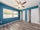 Bedroom boasts natural light, closets, and durable luxury vinyl plank flooring at 9292 120Th Ln, Seminole, FL 33772