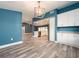 Bright dining room showcases a modern chandelier and luxury vinyl floors at 9292 120Th Ln, Seminole, FL 33772