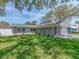 Inviting single-story home with a well-maintained lawn, showcasing a peaceful residential setting at 9292 120Th Ln, Seminole, FL 33772