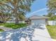 Charming single-story home featuring a two-car garage, stone accents and a well-manicured lawn at 9292 120Th Ln, Seminole, FL 33772