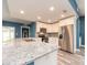 Bright, updated kitchen with granite countertops, stainless steel appliances and ample cabinet space at 9292 120Th Ln, Seminole, FL 33772