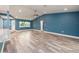 Bright living area boasts wood floors, an open layout, and a connection to the kitchen at 9292 120Th Ln, Seminole, FL 33772