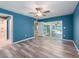 Main bedroom features a ceiling fan and sliding glass doors to the pool and patio at 9292 120Th Ln, Seminole, FL 33772
