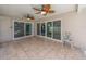 Relaxing tiled patio with ceiling fans offering serene outdoor living space at 9292 120Th Ln, Seminole, FL 33772