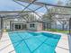 An inviting pool with a screen enclosure is perfect for outdoor recreation at 9292 120Th Ln, Seminole, FL 33772
