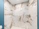 Stunning shower stall features designer tile, built-in bench, and sleek fixtures at 9292 120Th Ln, Seminole, FL 33772