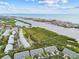 Stunning aerial view of the community with lush greenery and ocean views, located near the water at 9812 Indian Key Trl # 84, Seminole, FL 33776