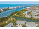 Breathtaking aerial view of waterfront condos nestled amongst lush green foliage and blue waterways at 9812 Indian Key Trl # 84, Seminole, FL 33776