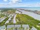Beautiful aerial view of the community with mature landscaping and views of the ocean and waterways at 9812 Indian Key Trl # 84, Seminole, FL 33776