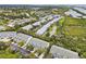 An aerial view showcasing the layout of the townhome community with waterway views at 9812 Indian Key Trl # 84, Seminole, FL 33776
