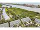 Aerial view of the waterfront community featuring beautiful mangroves, trees, and a calm canal at 9812 Indian Key Trl # 84, Seminole, FL 33776