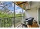 Screened-in balcony featuring comfortable seating, offering serene views of the surrounding landscape at 9812 Indian Key Trl # 84, Seminole, FL 33776