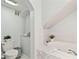 Bright bathroom with a deep soaking tub, tiled walls, and a plant for a fresh, clean atmosphere at 9812 Indian Key Trl # 84, Seminole, FL 33776