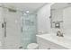 Modern bathroom features a glass-enclosed shower, stylish fixtures, and a white vanity at 9812 Indian Key Trl # 84, Seminole, FL 33776
