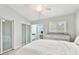 Bright bedroom featuring an adjacent office area and ample natural light at 9812 Indian Key Trl # 84, Seminole, FL 33776