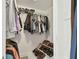 Walk-in closet with built-in shelving for shoes and hanging clothes at 9812 Indian Key Trl # 84, Seminole, FL 33776