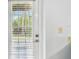 Door with blinds, offering natural light and privacy at 9812 Indian Key Trl # 84, Seminole, FL 33776