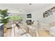 Bright living room with a comfortable sectional sofa, balcony access, and modern decor at 9812 Indian Key Trl # 84, Seminole, FL 33776