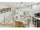 An open living space with a staircase, kitchen, dining area, and custom coffee bar at 9812 Indian Key Trl # 84, Seminole, FL 33776