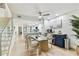 An open living space with a staircase, kitchen, dining area, and custom coffee bar at 9812 Indian Key Trl # 84, Seminole, FL 33776