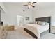Cozy bedroom featuring a tufted headboard, neutral decor, and modern furniture at 9812 Indian Key Trl # 84, Seminole, FL 33776