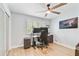 Bright office with a large window, ceiling fan, and hardwood floors at 9812 Indian Key Trl # 84, Seminole, FL 33776