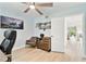 Cozy office space with hardwood floors, a ceiling fan, and a light blue wall at 9812 Indian Key Trl # 84, Seminole, FL 33776