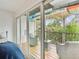 Relaxing patio featuring outdoor furniture and views of lush greenery at 9812 Indian Key Trl # 84, Seminole, FL 33776