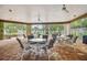 Community covered patio with table and chairs at 9812 Indian Key Trl # 84, Seminole, FL 33776